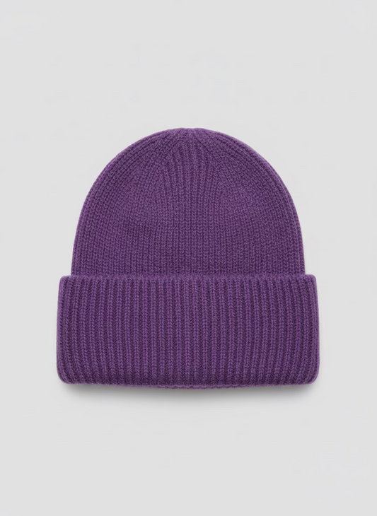 Purple knit beanie on a white surface